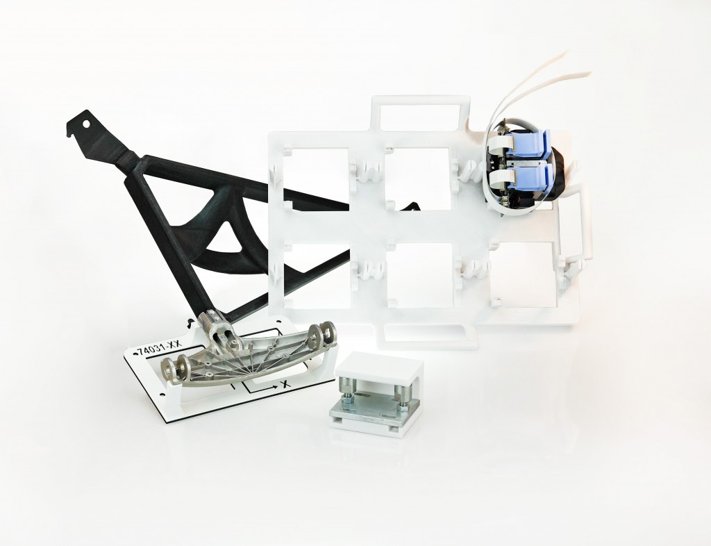 Custom manufacturing tools produced from ASA, PC and new Nylon 6 thermoplastic material. All three materials are part of the Manufacturing Aids Package for the Fortus 900mc Production 3D Printer. Courtesy of Stratasys. 